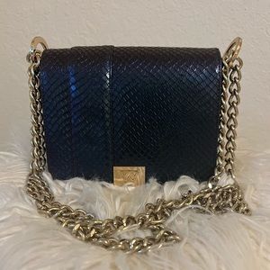 Kelly Wynne Game Changer Mini bag in black/purple/blue iridescent snakeskin